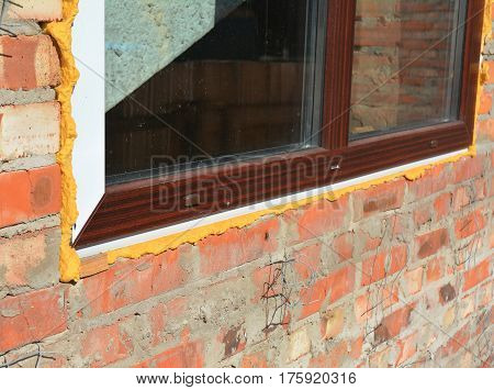 How To Install A PVS Window. Close up on plastic window installation. Single plastic window insulation. detail. Install window. Window insulation with Spraying Foam.