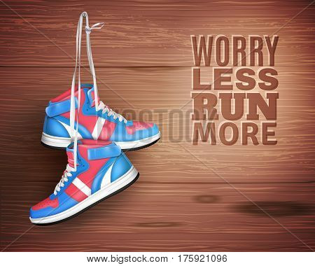 Pair of sports shoes hanging on nail in wood background with description worry less run more realistic vector illustration