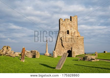 Aberystwyth Wales United Kingdom - September 21 2016: View of remains of the north tower gateway at Aberystwyth Castle. Building work started in 1277 at the time of the First Welsh War. War Memorial is visible on background.