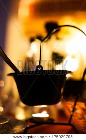 typical hungarian gulyas soup served in small cauldron in restaurant