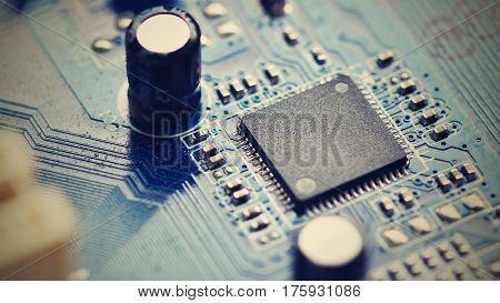 Components on board. PCB to PC. Chip capacitor and connectors on the motherboard of a personal computer. Modern technological background.