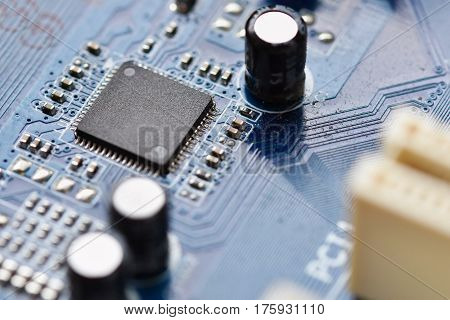 Components on board. PCB to PC. Chip capacitor and connectors on the motherboard of a personal computer. Modern technological background.