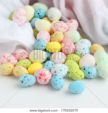 Easter stilllife. Colored eggs on a white background