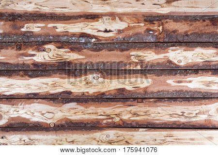 Old natural wooden unedged textured background closeup