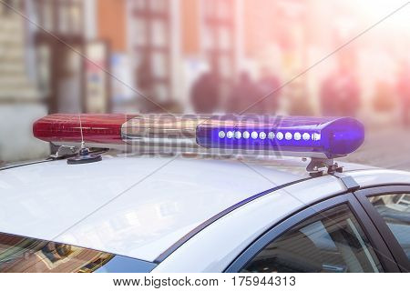 police light and siren on the car in the street