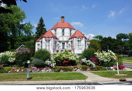 HARBOR SPRINGS, MICHIGAN / UNITED STATES - AUGUST 4, 2016: The Hexagon House, designed by Ephraim Shay as his home in 1892, has 6 hexagonal rooms on the ground floor, and was constructed of stamped steel.