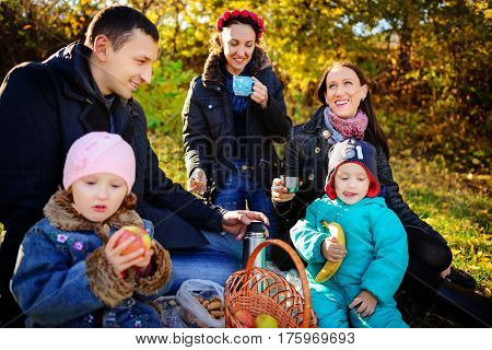 Girl Sitting On The Grass With An Apple In His Hand