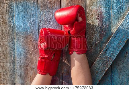 Two female hands in red  boxing gloves