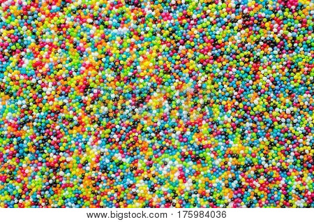 Sugar sprinkle dots, decoration for cake and bekery, a lot of sprinkles as a background.