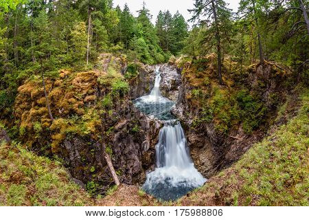 Wide angle perspective of Upper Falls at Little Qualicum Falls near Qualicum Beach and Parksville on Vancouver Island British Columbia Canada.
