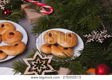 Swedish Christmas. Traditional Swedish Buns On Cake Stand In Christmas Setting. A Saffron Bun, In Sw