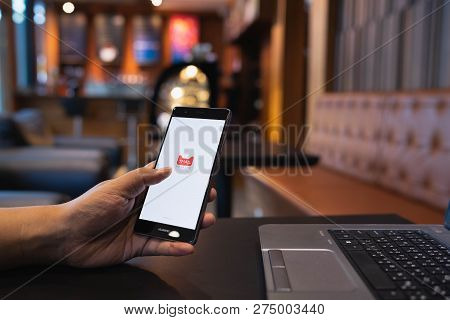 Chiang Mai, Thailand - May 05,2018: Man Holding Huawei With Tmall Apps On The Screen.tmall.com Is An