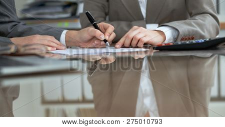 Business People Or Lawyers Signing Contract At Meeting. Close-up Of Human Hands At Work