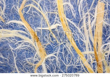 Natural Thai mulberry kozo paper against blue background