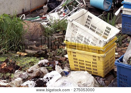 Plastic Fruit Basket Crate Box And Pile Of Waste Plastic Bags, Plastic Bag In Water Waste Rotten Riv