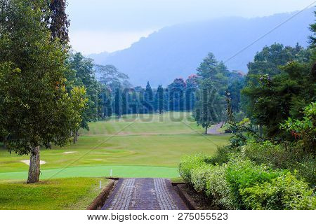 View Of Golf Resort Field With Green Trees Around In Bedugul, Bali, Indonesia