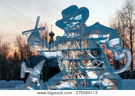 Karabas-barabas. Ice Sculpture-evil Puppeteer Controls A Puppet On The Background Of A Religious Tem