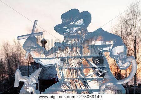 Karabas-barabas. Ice Sculpture-evil Puppeteer Controls A Puppet On The Background Of A Religious Tem
