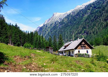 A House Near The Mountains In Austria.