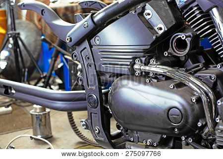 Cropped Close Up Shot Of Beautiful And Custom Made Motorcycle In The Workshop