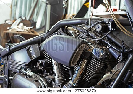 Cropped Close Up Shot Of Beautiful And Custom Made Motorcycle In The Workshop