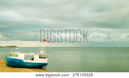 Fishing Boat On Baltic Sea Coast. Stormy Weather. Mechelinki, Poland, Pucka Bay.