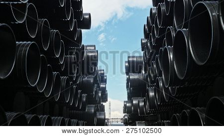 Warehouse Of Finished Plastic Pipes Industrial Outdoors Storage Site. Manufacture Of Plastic Water P