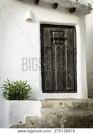 Typical Residence With White Walls And Wood Door Of The Fishing Village Binibeca Menorca Spain