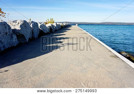 Large Boulders, Next To The Pier, Serve As A Breakwall To Protect The Bay View Swimming Beach From T