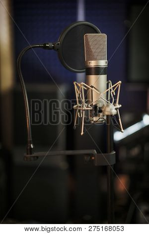 Professional Microphone In The Recording Studio. Musical Concept. Microphone On Stage.