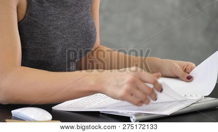 Hands Holding Notebook White Color And Turning Pages.