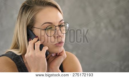 Young Business Woman With Confused Face, Talking On The Phone.