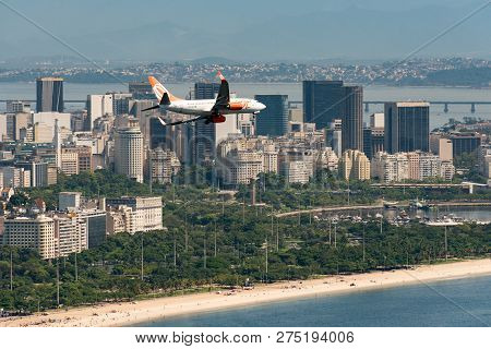 Rio De Janeiro, Brazil - November 23, 2018: Gol Airlines Aircraft Is Flying Above Rio De Janeiro Cit