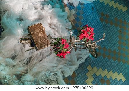Old Retro Tandem Bicycle And Christmas Decors, Red Flowers. Travel Photo 2018. December.