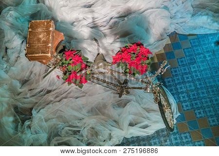 Old Retro Tandem Bicycle And Christmas Decors, Red Flowers. Travel Photo 2018. December.