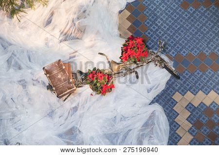 Old Retro Tandem Bicycle And Christmas Decors, Red Flowers. Travel Photo 2018. December.