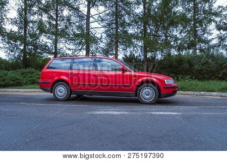 Red Wolksvagen Passat B5 To Street, Trees An Way. Travel Photo 2012.