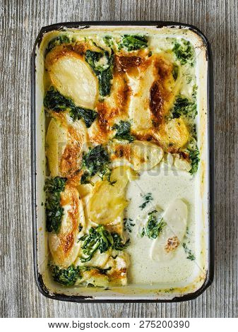 Close Up Of Rustic Golden Spinach Potato Gratin Dauphinois