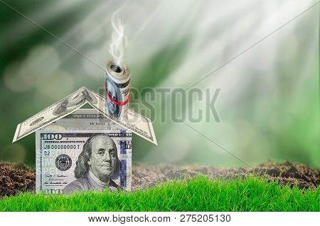 Dollaes And Houses On Hand In Sunlight Show Savings To Buy A Home Or Buy Real Estate. Or Show A Home