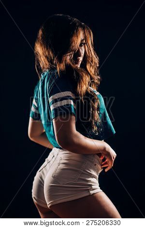 Portrait Of Beautiful Sports Fitness Or Dancer Brunette Woman In The Dark On Black Background. Sexy