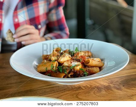 Rigatoni Pasta With Eggplant, Tomato Sauce, Mozarella, Parmesan Cheese And  Basil Leaves / Aubergine