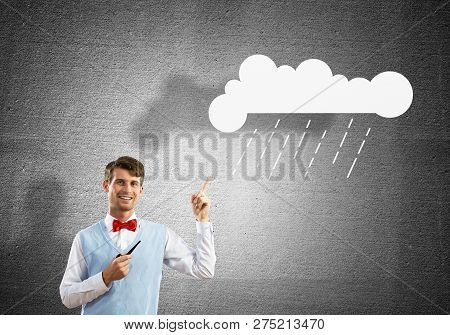 Horizontal Shot Of Confident And Young Businessman In Smart-casual Wear Smoking Pipe And Pointing Up
