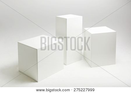 3d Illustration Of White Cubes And Parallelepipeds On Cyclorama In Modern Photo Studio