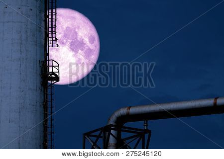 Cold Moon Back Over Silhouette Refinery Oil Tank