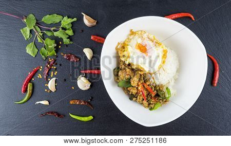Spicy Thai Basil With Crispy Chicken And Egg (pad Krapow Gai) On Table . It Is A Very Delicious Thai