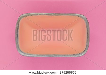 Top View Of Rectangular Pink Empty Dish With Silver Edges On Pink Background