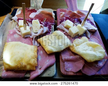 Traditional Bolognese Meal, Mortadella, Crescentine, Salame, Cheese. Bologna, Italy