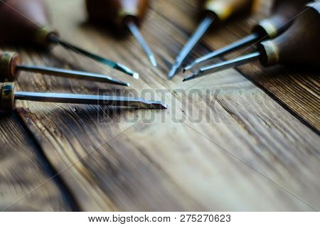 Different Gravers For Jewelry On A Wooden Background