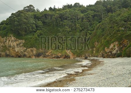 Beautiful Cliffs And Shore Of Stones In The Beach Of The Mills In Barcia. July 30, 2015. Beach Of Lo