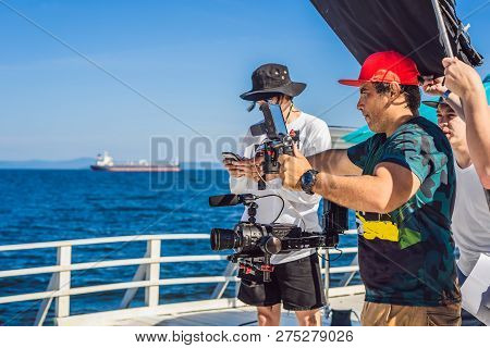 Professional Steadicam Operator Uses A 3-axis Camera Stabilizer System On A Commercial Production Se